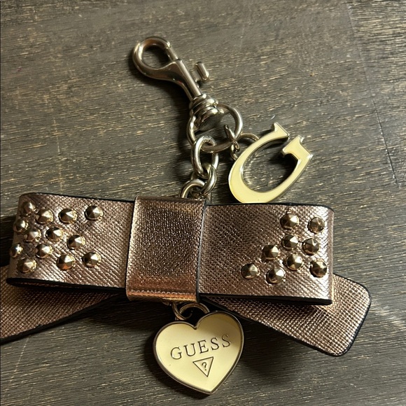 Guess Metallic Rose Gold Bow Purse Charm - Picture 1 of 3